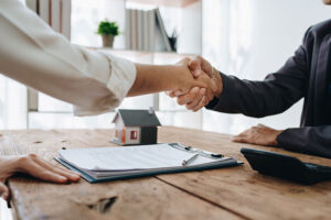 Professional shakes hands with therapist as they enter executive drug rehab program