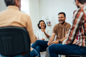 People talk and bond while enjoying group therapy activities