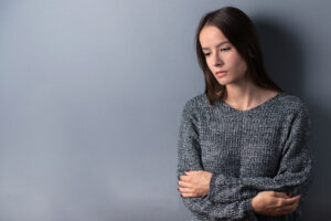Woman thinking about the benefits of PTSD treatment